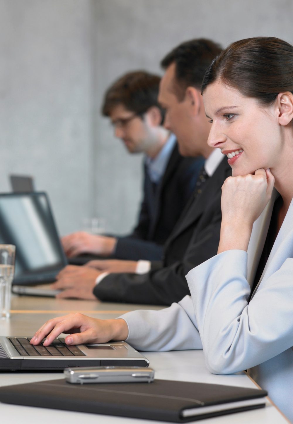 businesswoman-using-laptop-smiling.jpg
